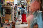 A family shops in a toy store in Princeton, N.J.
