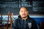 Carlo Lamagna, the owner and chef of Magna Kusina in Portland, Ore., poses for a portrait inside his closed restaurant on Friday, March 27, 2020. Lamagna laid off his entire staff and closed the business following Oregon Gov. Kate Brown's order to halt dine-in eating at restaurants in response to the coronavirus outbreak. 