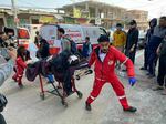 Workers rush injured people to Mohammed Yousef al-Najjar Hospital in Rafah as Israel resumed its bombing Friday morning in the Gaza Strip.