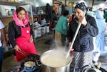 Volunteers prepare food and drink for langar at the Sikh Center of Oregon.