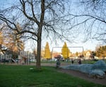 Children in the play area of a closed school in Portland, Ore., on Thursday, March 19, 2020.