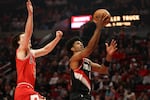 Portland Trail Blazers guard Scoot Henderson, right, drives to the basket as Chicago Bulls guard Josh Giddey defends during the first half of an NBA basketball game Sunday, Jan. 19, 2025, in Portland, Ore.