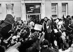 Protesters against the United States' participation in the Vietnam War are seen outside the national headquarters of the Selective Service System, which oversees the draft, on May 3, 1971, in Washington, D.C.