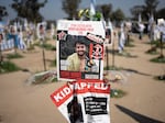 A poster depicting Israeli-American hostage Hersh Goldberg-Polin is displayed in Re'im, southern Israel at the Gaza border in February 2024 at a memorial site for the Nova music festival site where he was kidnapped to Gaza by Hamas on Oct. 7, 2023.
