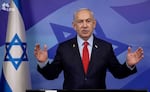 In this screen grab image from video provide by the Israeli Government Press Office, Israeli Prime Minister Benjamin Netanyahu makes a televised statement Tuesday, Nov. 26, 2024, in Jerusalem, Israel.