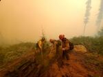 Firefighters suppress spot fires on a slope while battling the Lionshead Fire near the Warm Springs Indian Reservation Aug. 31, 2020.