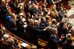 French lawmakers debate in the National Assembly in Paris Wednesday. A majority of legislators voted to oust Prime Minister Michel Barnier, forcing him to resign.