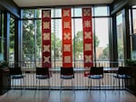 A series of birchbark art pieces hang down on the first floor of the Vernier Science Center, greeting visitors as they first walk through the main doors.