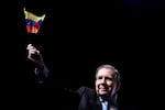 Venezuela's opposition leader Edmundo Gonzalez waves a Venezuelan flag during a meeting with supporters in Panama City, Wednesday, Jan. 8, 2025