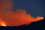 The Washburn Fire burns near the south entrance of Yosemite National Park on July 11 near Oakhurst, Calif.