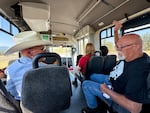 Ken “Buck” Buckley (right) speaks with another rider on the Kayak bus operated by the Confederated Tribes of the Umatillia Indian Reservation on September 2, 2025. He ended up riding the bus after his truck broke down and he discovered there's no more Greyhound service in Eastern Oregon.
