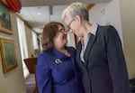 FILE - Oregon Gov. Tina Kotek, right, and her wife, Aimee Kotek Wilson, prepare to enter the inaugural proceedings at the Oregon Capitol in Salem, Ore., Jan. 9, 2023.