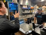 ASL teacher Sarah Caine orders dinner at Pah! restaurant from owner Lillouie Barrios. Located in The Zed in SE Portland,   the restaurant is proudly queer, Latinx, and deaf owned.