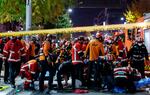 Rescue workers and firefighters work on the scene of a crushing accident in Seoul, South Korea, on Saturday.