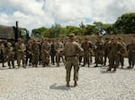 Marines of the 12th Marine Littoral Regiment assemble before a land navigation exercise on Okinawa.