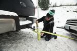 Christian Bartlett, a construction worker, estimates he's pulled 10 people out of the snow. "It makes everyone lives a lot easier to pull over and help them out, versus driving by."