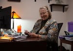 A woman sitting at her desk.