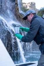 Crews have to work in challenging conditions as they treat this part of the mid-Snake River.