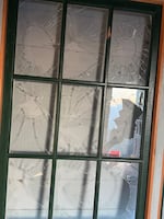 Glass panes smashed out in act of vandalism June 12, 2026. These historic windows were originally installed in the High Rock Lookout in 1931 and were restored to original condition by volunteers with the Sand Mountain Society over a period of four years before being reinstalled at the lookout in 2025.