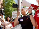 FILE - Protesting nurses gathered on the street corner in front of the Legacy Good Samaritan emergency department on July 29, 2023, to demonstrate against violence in health care settings. 