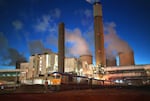 A train delivers coal by night at the Ratcliffe-on-Soar power station in Nottinghamshire, England. In its heyday, the plant received more than 20 truckloads of coal per day.