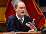 Fulton County Superior Judge Scott McAfee presides in court during a hearing in the Georgia election interference case.