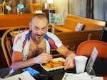 Slovenian cyclist Andrej Zaman stops at Spoke'N Hostel in Mitchell, Ore., for a meal while cycling the TransAmerica bike trail Monday, June 3, 2019. "Everywhere I mention this in Slovenia," Zaman said. "They don't know where this city is, but I know."
