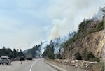 This image provided by the Oregon Department of Transportation shows one lane of southbound Interstate 5 near Ashland closed as crews fight the Neil Creek Fire.