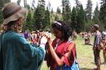 Gatherers pray and meditate together on July 4 at the annual gathering of the Rainbow Family of Living Light.