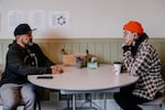 In this undated photo provided by Outside In, a substance use peer supervisor chats with an employee. The organization's peer mentors "bring lived experience with substances and an ability to understand what their clients are going through at a deeper level," according to Justine Ziegler, the organization's development director.