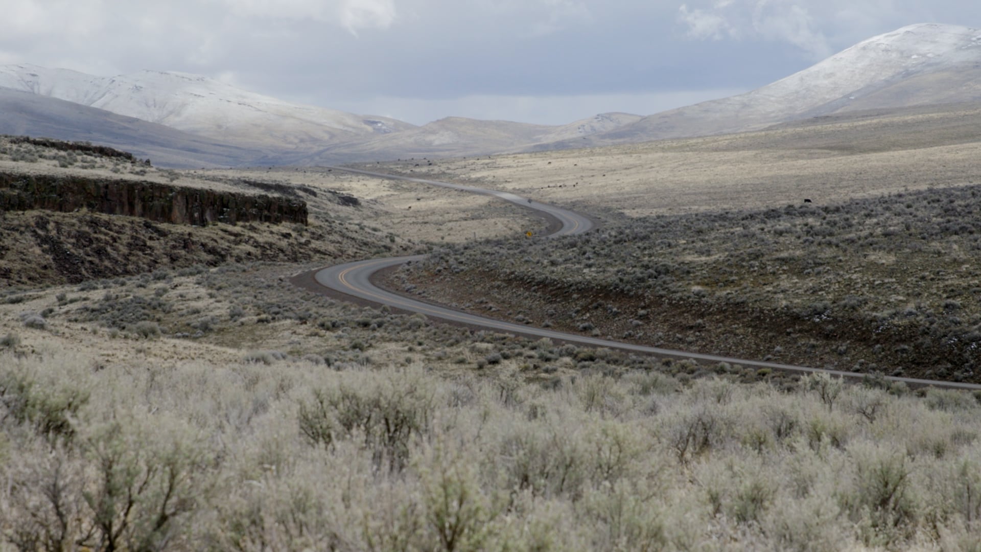 A road snakes through Roaring Springs Ranch near Steens Mountain in southeast Oregon on April 2, 2025.