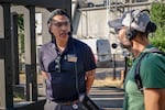 Dr. Carlos Sanchez, the head veterinarian at the Oregon Zoo, talks with "Think Out Loud" host Dave Miller outside the elephant enclosure at the Oregon Zoo on Aug. 18, 2023.