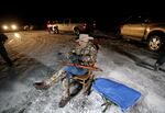 In this Jan. 5, 2016 file photo Arizona rancher LaVoy Finicum holds a gun as he guards the Malheur National Wildlife Refuge near Burns, Ore. Finicum, one of the leaders of the armed takeover of the refuge, was later shot by state police officers after he fled an attempted police stop. Experts say right-wing extremism like the Malheur takeover had previously mostly played out in isolated pockets or smaller cities in America before the deadly assault by rioters on the U.S. Capitol earlier this month. (AP Photo/Rick Bowmer, File)