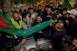 Relatives of Amal Hassan al-Durr, a 5-year-old girl, lay her body to rest at the cemetery in Majdal Zoun, southern Lebanon, on Feb. 22. She lost her life during an Israeli attack. In recent weeks, Israel has intensified its airstrikes, penetrating deeper into Lebanon.