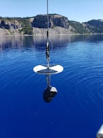 A Secchi disk is a simple but elegant tool used to measure the clarity of waterbodies like Crater Lake.
