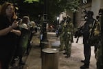 Protesters demonstrate against racism and police violence in front of the Mark O. Hatfield federal courthouse on July 12, 2020. Earlier in the night, federal law enforcement officers shot a demonstrator in the head with a less lethal impact munition, causing severe injury.