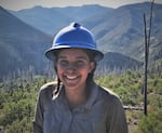 Tiffani Ayres smiles while working deep in the Siskiyou Wilderness of Southwestern Oregon. Wilderness Conservation Corps crews spend eight days at a time in the backcountry doing gritty work to restore trails.
