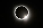 The Moon crosses in front of the Sun during a total solar eclipse at Lake Monroe on April 08, 2024 in Indiana, United States.
