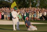 Rory McIlroy of Northern Ireland (R) celebrates winning with caddie Harry Diamond (L) after the playoff hole during the final round of the 2025 Masters Tournament at Augusta National Golf Club on April 13 in Augusta, Ga.