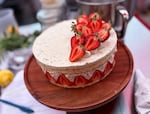 A fraisier cake made by Michelle Wald awaits judging at the Big Portland Bake Show on June 27, 2026. The classic French cake is traditionally made with a sponge cake, pastry cream, and fresh strawberries.