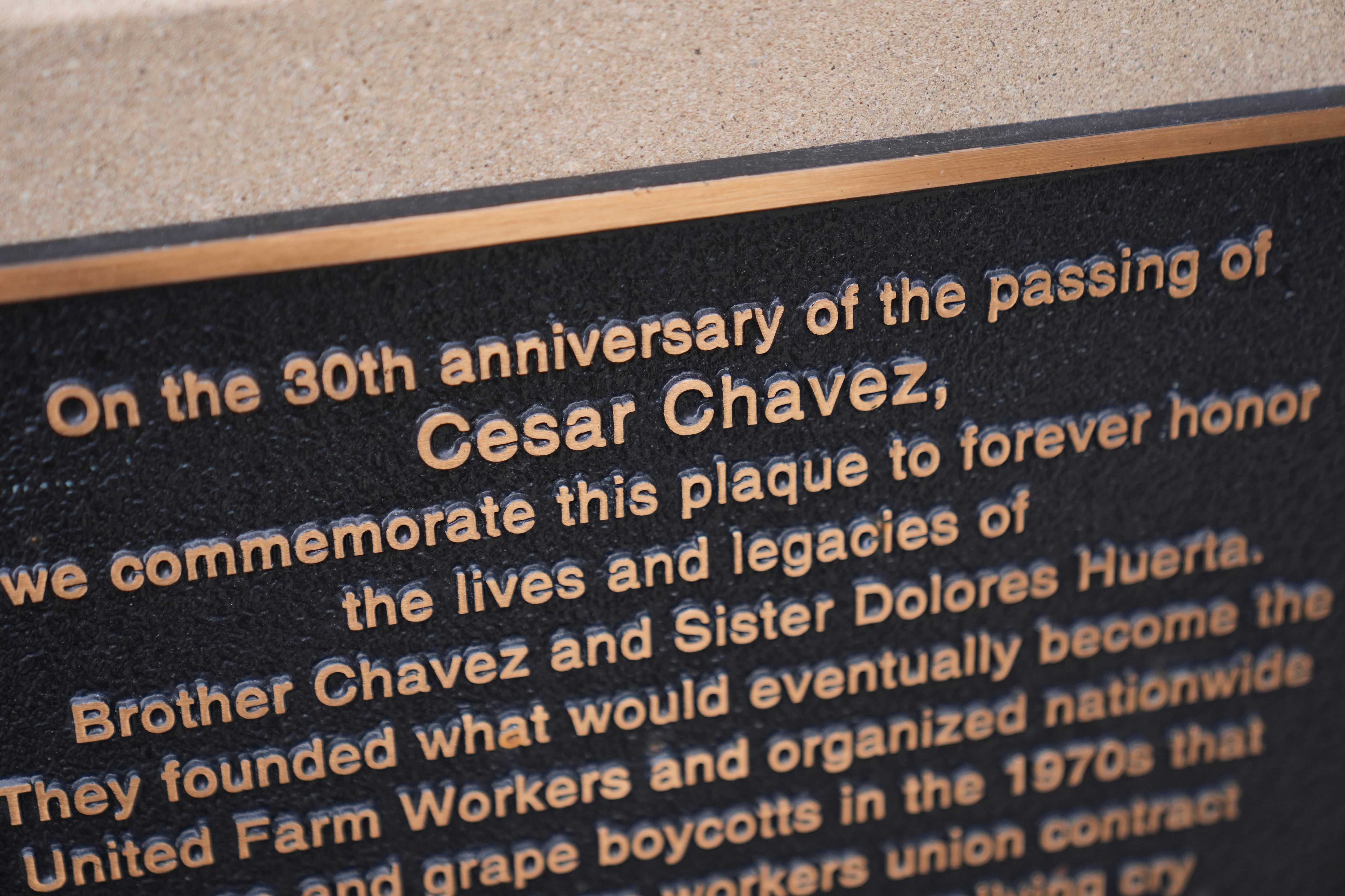 A plaque dedicated to the 30th anniversary of the passing of Cesar Chavez, honoring Chavez and Sister Dolores Huerta, is part of the Haymarket Memorial, seen Wednesday, March 18, 2026, in Chicago.