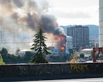 A fire boat, among other emergency vehicles, helps to put out a fire in Northwest Portland, Ore., on Aug. 2, 2026.