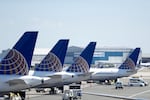 In this July 18, 2018, file photo, United Airlines commercial jets sit at a gate at Terminal C of Newark Liberty International Airport in Newark, N.J.