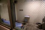 An inmate sleeps in a cell at the Josephine County Jail.