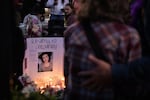 Friends and family gather to remember Alex Simpson, aka Deb Auchery, at Peace Corner in Bend, Ore., Friday, Sept. 30, 2022.