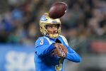 FILE - UCLA quarterback Dante Moore, who has since transferred to Oregon, throws a pass against California during the first half of an NCAA college football game Saturday, Nov. 25, 2023, in Pasadena, Calif.