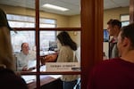 In this supplied photo, the staff of The Bulletin delivers papers stating their intent to form a union to Editor Gerry O'Brien, left, at the newspaper's offices in Bend on Oct. 20, 2023. The 11 members of the proposed union, called Central Oregon NewsGuild, are seeking greater pay and job security.