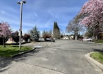 One of the new homeless campsites, located on 6th Street in Grants Pass, Ore., is equipped with a parking lot nearby, as shown on March 25, 2025.