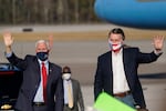 Vice President Mike Pence, left, and Sen. David Perdue, R-Ga., right, leave after a "Save the Majority" rally on Thursday, Dec. 10, 2020, in Augusta, Ga.