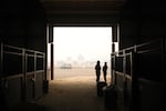 Rep. Shelly Boshart Davis, left, stands in the cavernous livestock shelter at the Linn County fairgrounds in Albany, Ore., Sept. 8, 2020. Many who live and/or board their animals in the area had to scramble to safely get livestock and pets out of the fire zone.